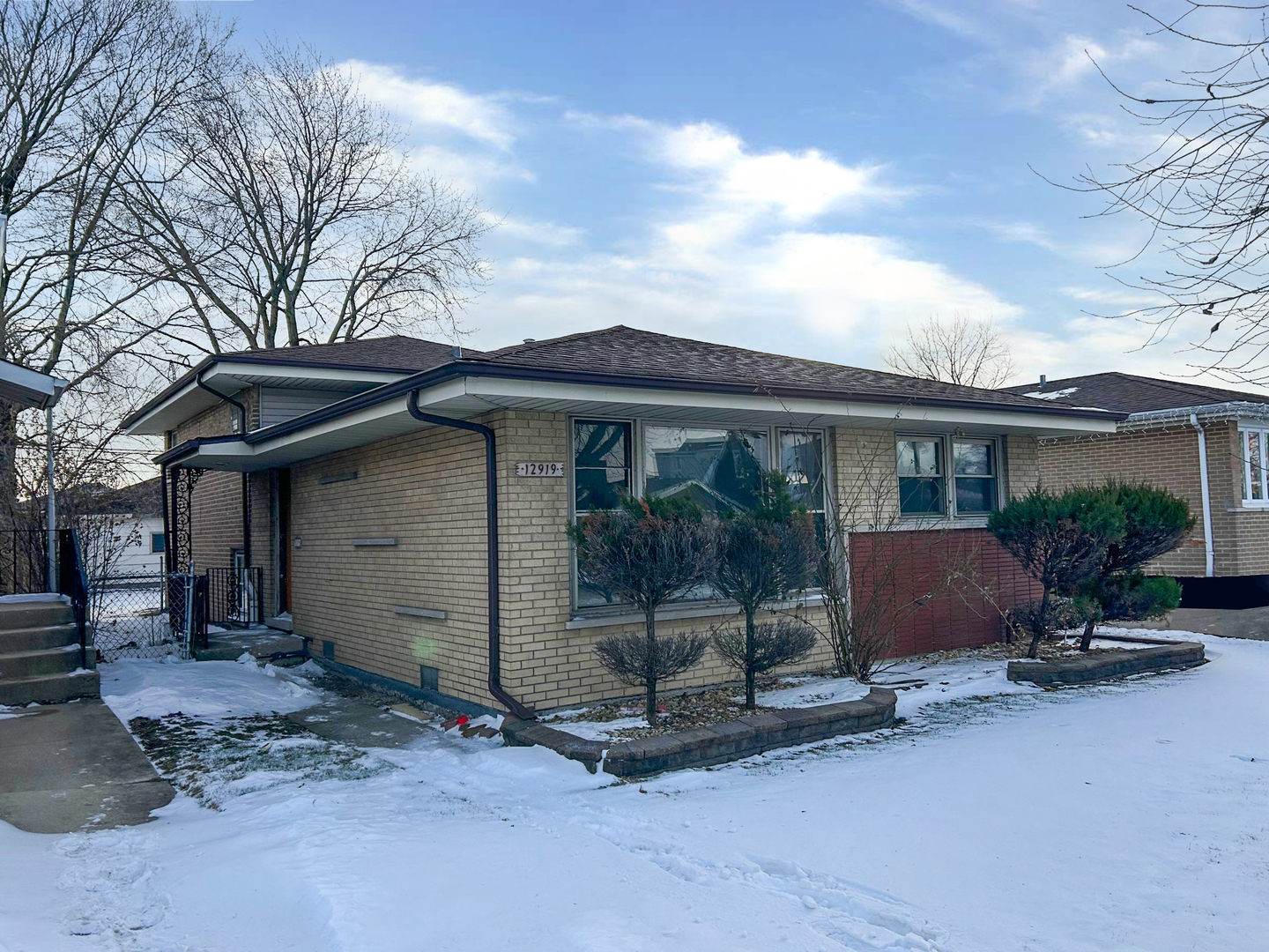 12919 South Escanaba Avenue Chicago, IL 60633 - Photo 2 of 16 a view of a house with backyard sitting area and garden