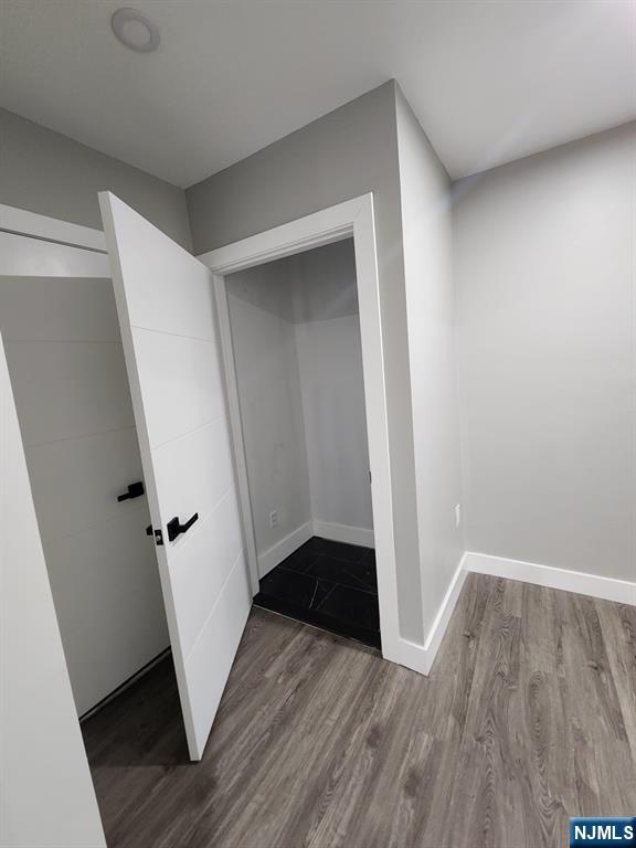93 Hughes Street, Unit 2 Maplewood, NJ 07040 - Photo 11 of 16 an entryway space with wooden floor and staircase