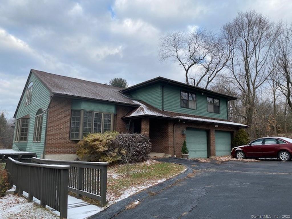 279 Spindle Hill Road Wolcott, CT 06716 - Photo 1 of 1 a front view of a house with garden