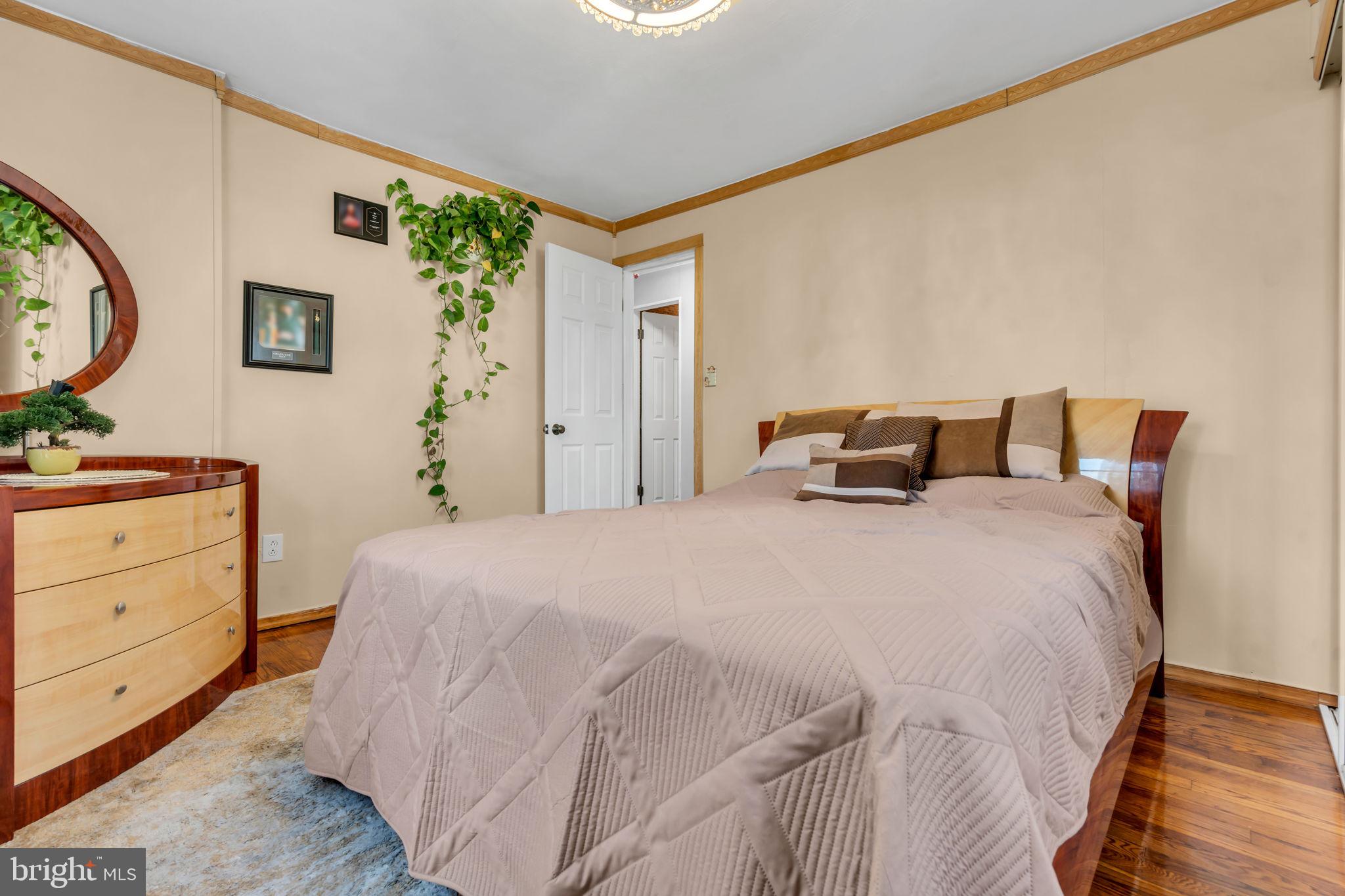 80 Locust Avenue Hamilton, NJ 08620 - Photo 16 of 24 a bedroom with a bed and a dresser in it