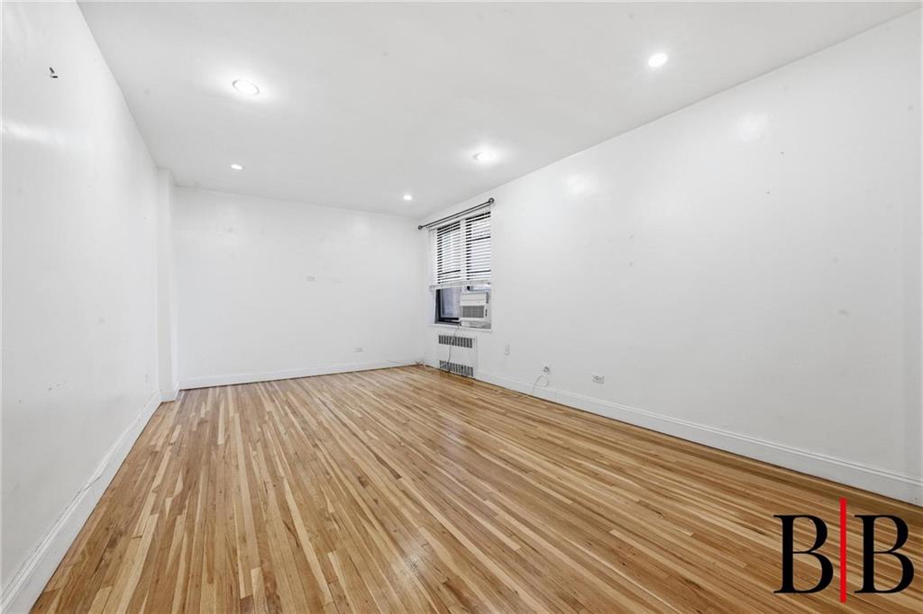 2270 Plumb 1 Street, Unit 2D Brooklyn, NY 11229 - Photo 2 of 13 a view of empty room with wooden floor