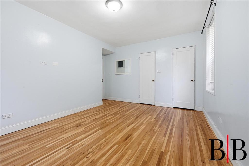 2270 Plumb 1 Street, Unit 2D Brooklyn, NY 11229 - Photo 7 of 13 a view of empty room with wooden floor