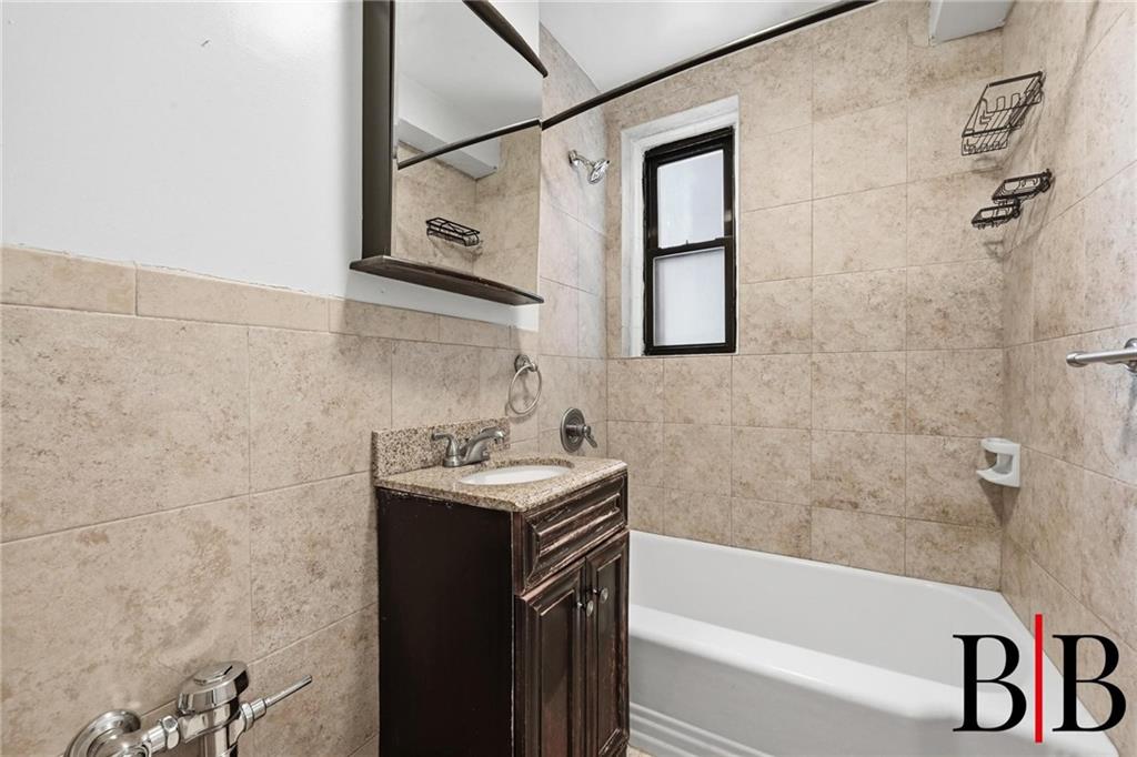 2270 Plumb 1 Street, Unit 2D Brooklyn, NY 11229 - Photo 9 of 13 a bathroom with a sink and a bathtub