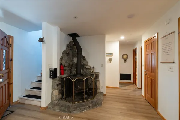 a kitchen with stainless steel appliances a stove a sink and a microwave