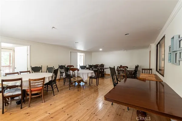 a view of a dining area with furniture window and wooden floor