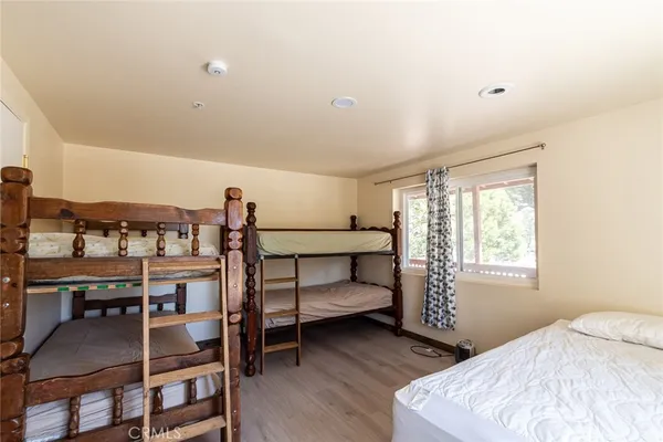 a bedroom with a bed and a table