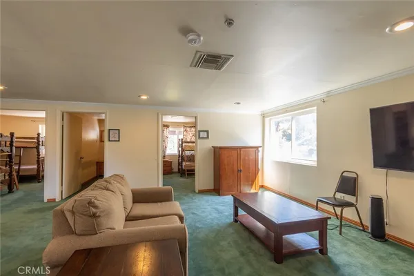 a bedroom with a bunk bed and a desk in it