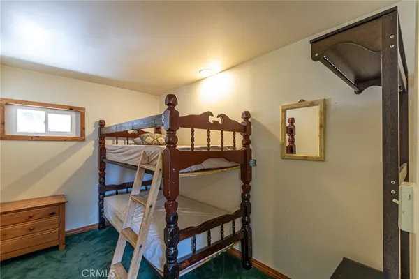 a view of a porch with chairs and couches