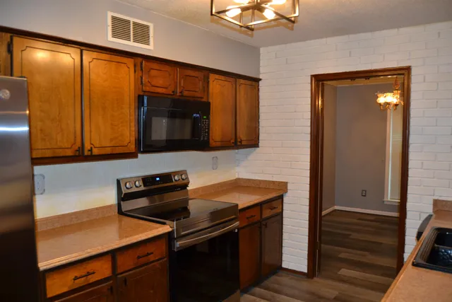a kitchen that has a sink and a stove