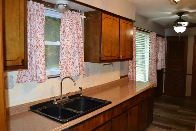 a kitchen with a sink and a window