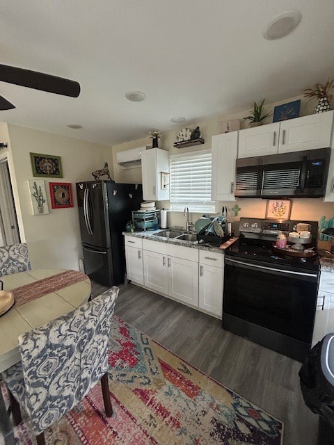 3020 Calhoun Street Bacliff, TX 77518 - Photo 3 of 14 a kitchen with stainless steel appliances granite countertop a stove top oven a sink and dishwasher