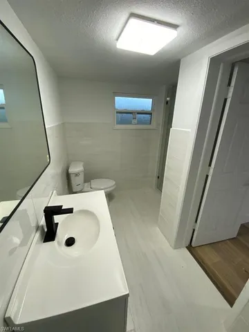 a bathroom with a sink and mirror