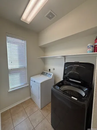 a view of utility room and washer and dryer