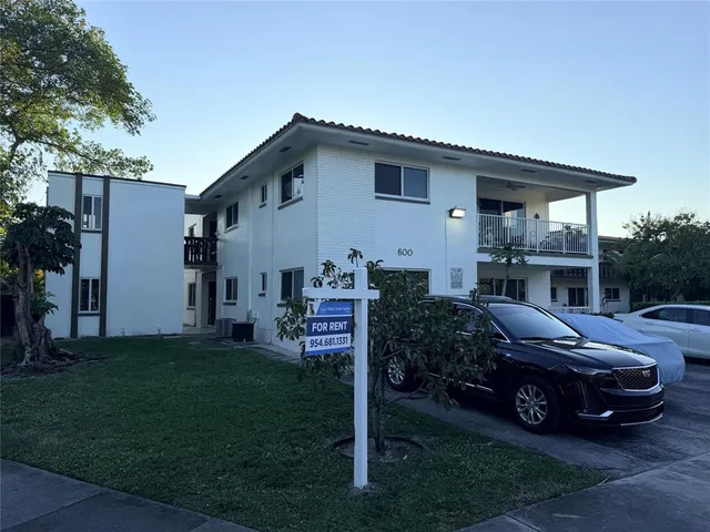 a view of a car in front of house