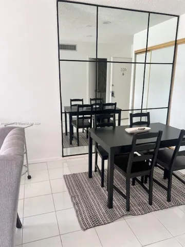 a view of a workspace with furniture