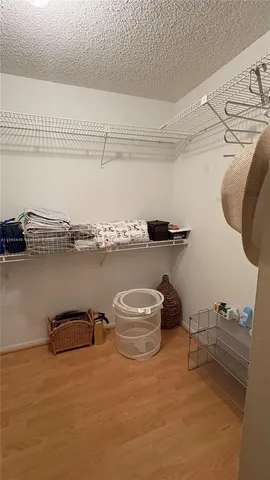 a view of a water heater and a cabinet