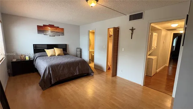 a bedroom with bed and window