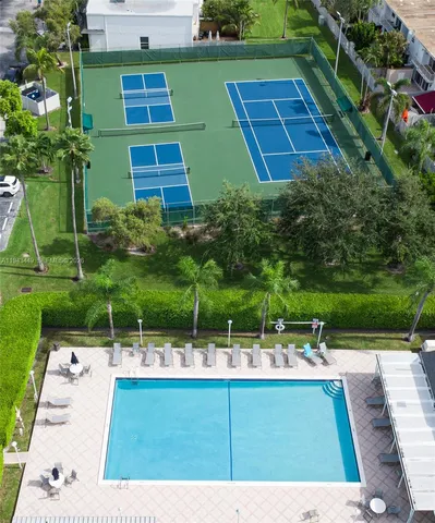 a view of swimming pool with outdoor seating and yard