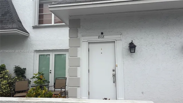 a view of bathroom with a sink and mirror