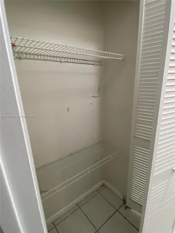 a view of a room with racks on the wall