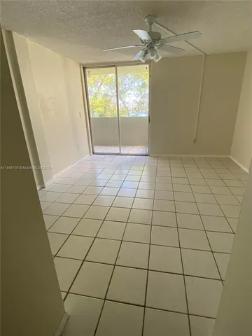 a view of empty room with windows