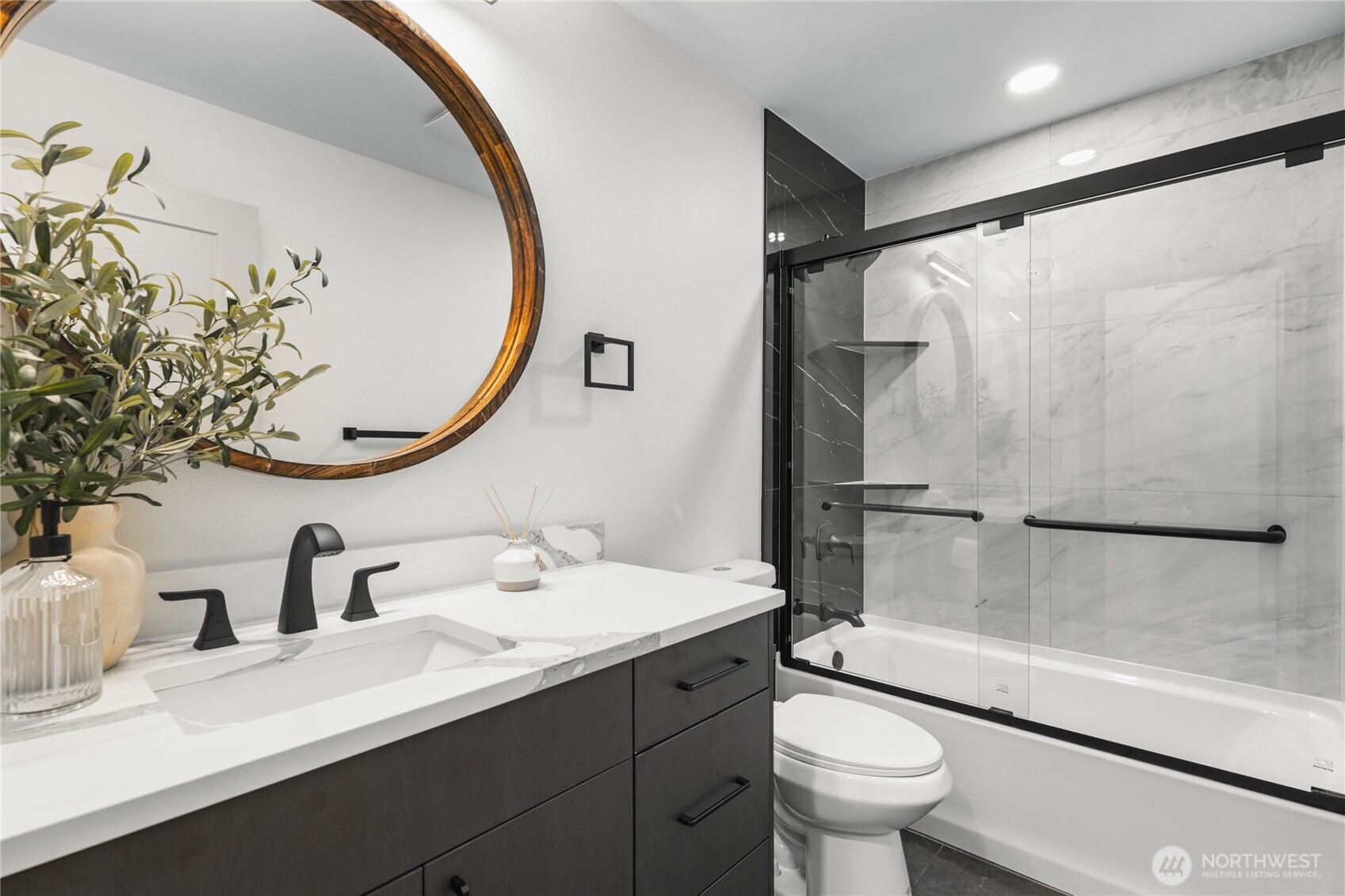 9825 32nd Avenue Southwest Seattle, WA 98126 - Photo 11 of 34 a bathroom with a sink and a mirror