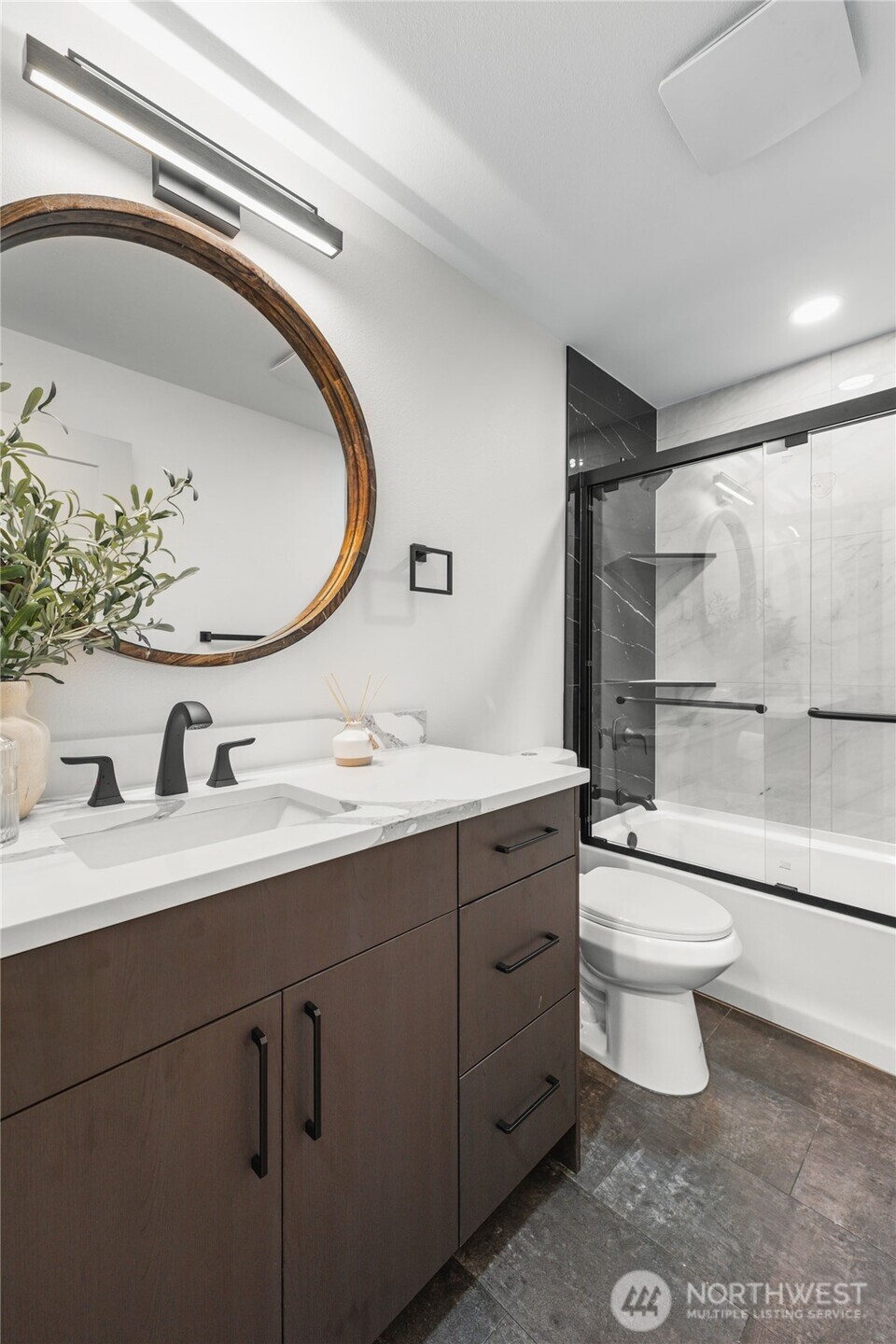9825 32nd Avenue Southwest Seattle, WA 98126 - Photo 13 of 34 a bathroom with a toilet sink and mirror