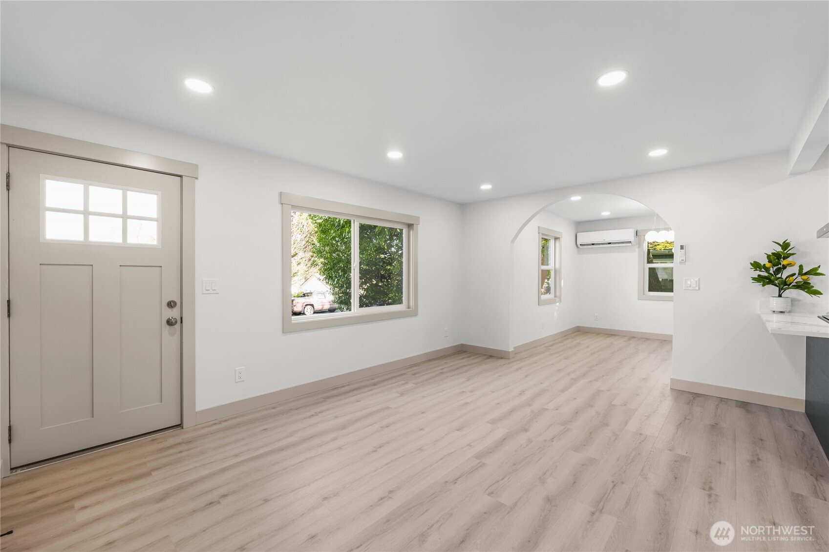 9825 32nd Avenue Southwest Seattle, WA 98126 - Photo 14 of 34 an empty room with wooden floor and windows