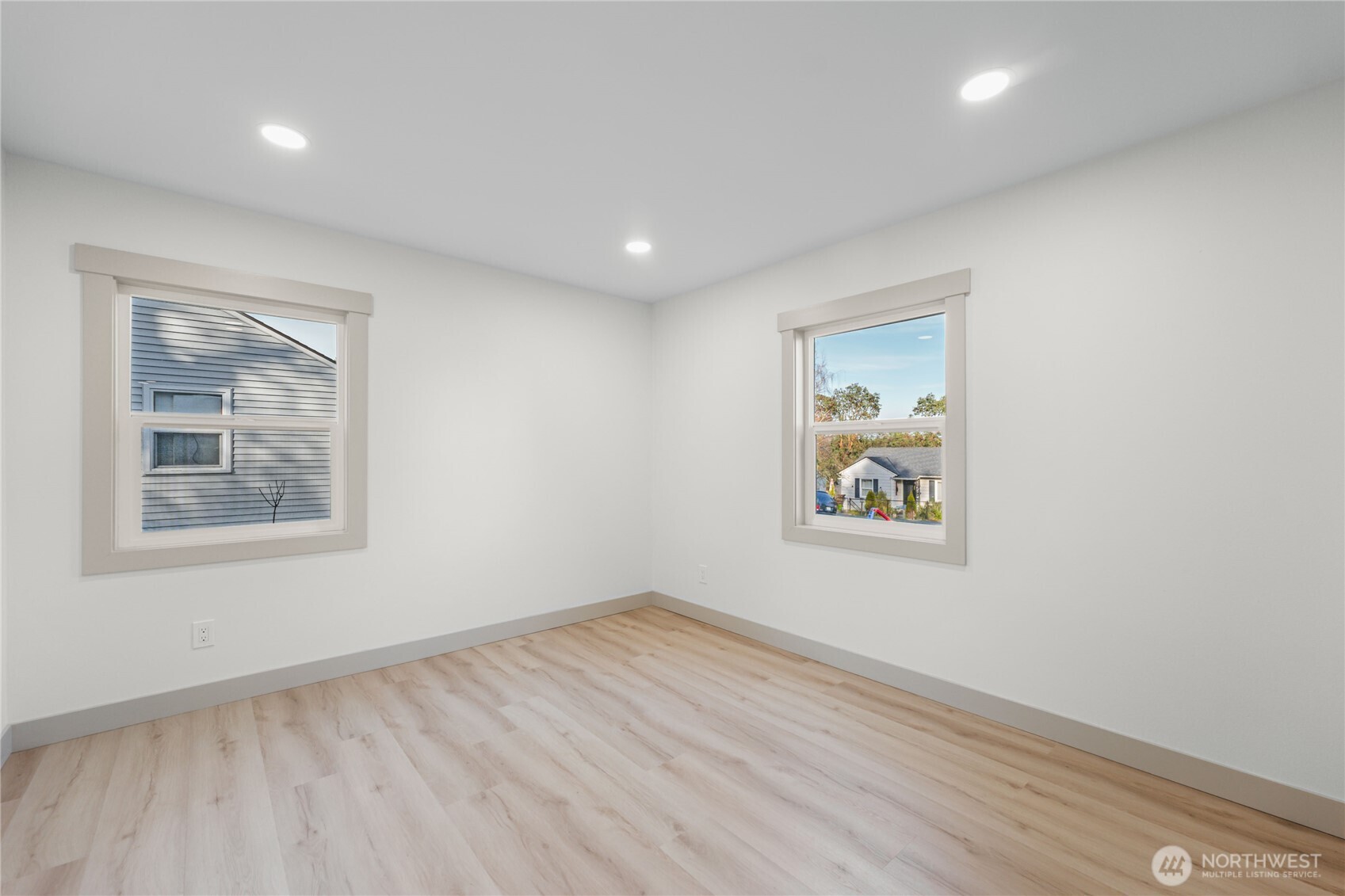 9825 32nd Avenue Southwest Seattle, WA 98126 - Photo 19 of 34 a view of an empty room with window and wooden floor