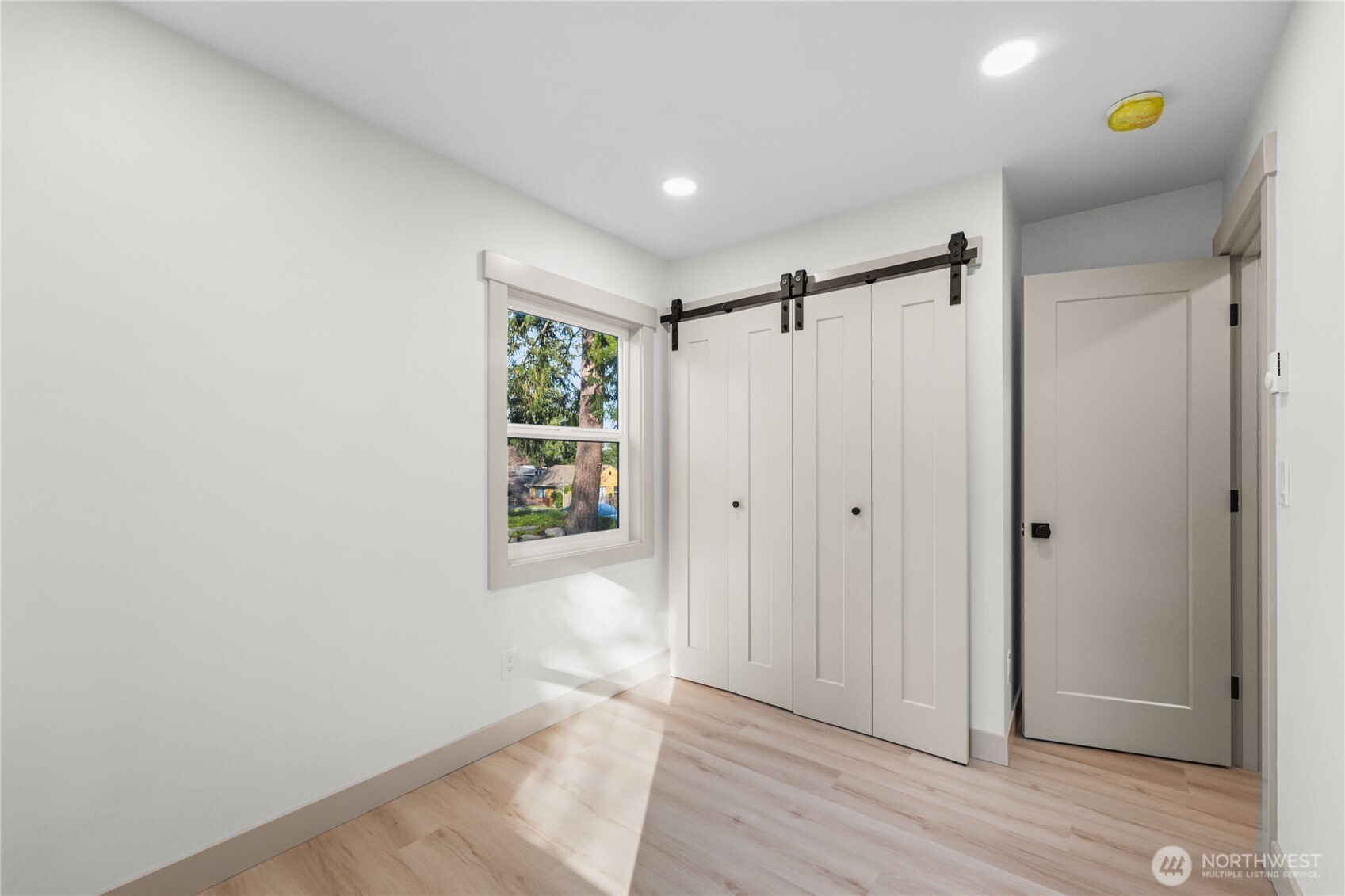 9825 32nd Avenue Southwest Seattle, WA 98126 - Photo 20 of 34 a view of entryway with wooden floor