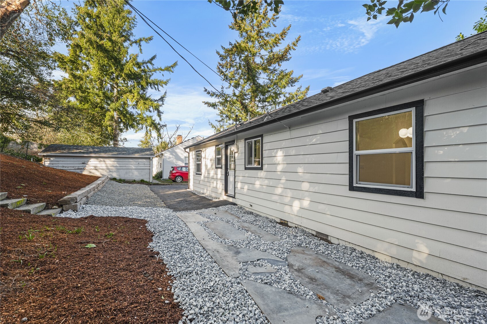 9825 32nd Avenue Southwest Seattle, WA 98126 - Photo 29 of 34 a view of a house with a yard