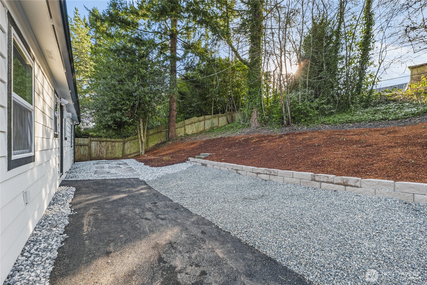 9825 32nd Avenue Southwest Seattle, WA 98126 - Photo 31 of 34 a view of a yard with plants and trees