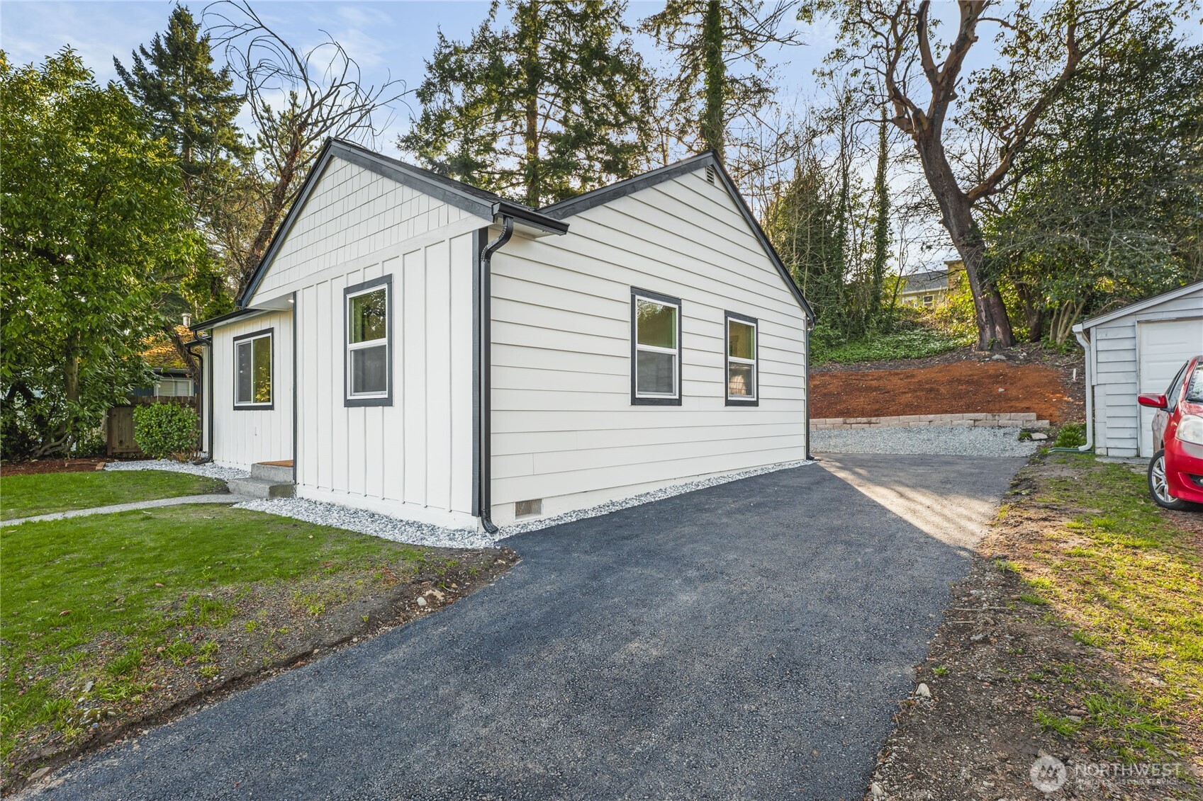 9825 32nd Avenue Southwest Seattle, WA 98126 - Photo 32 of 34 a view of a house with backyard and trees