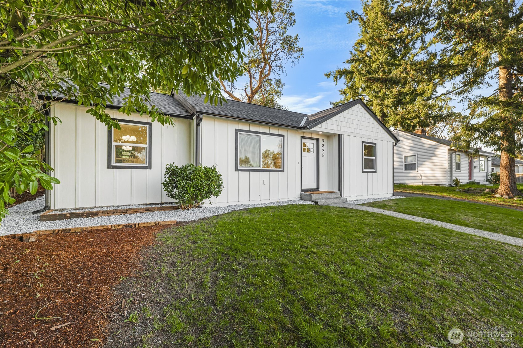 9825 32nd Avenue Southwest Seattle, WA 98126 - Photo 33 of 34 a view of a house with yard and a tree
