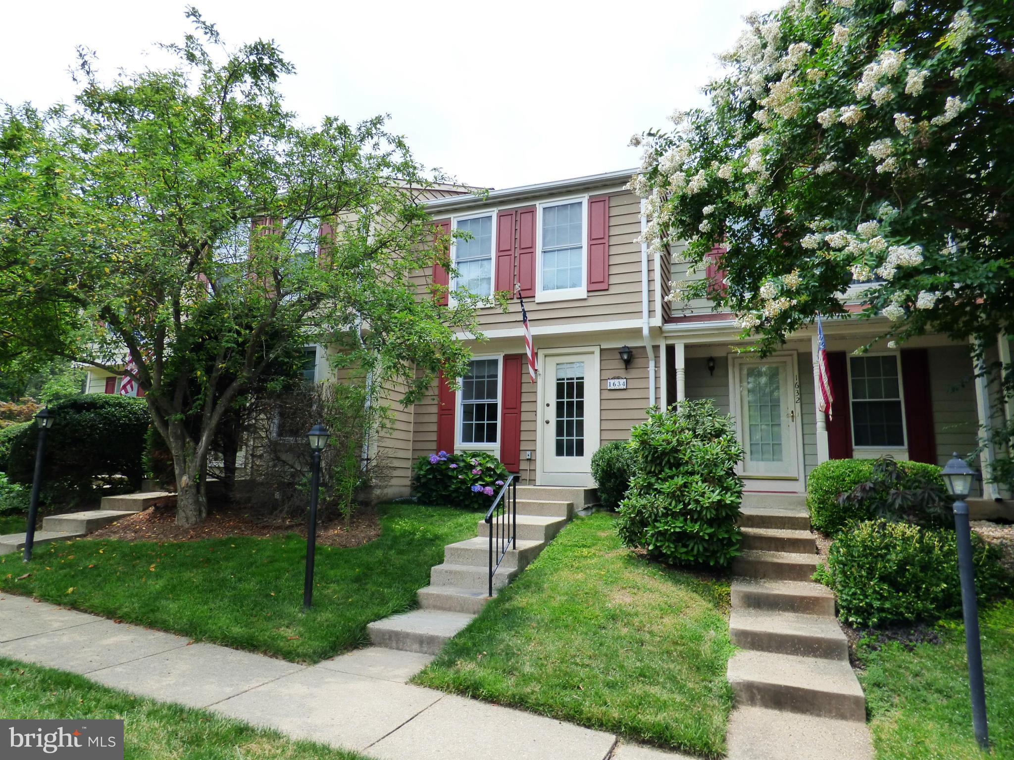 1634 Fieldthorn Drive Reston, VA 20194 - Photo 1 of 30 front view of a house and a yard