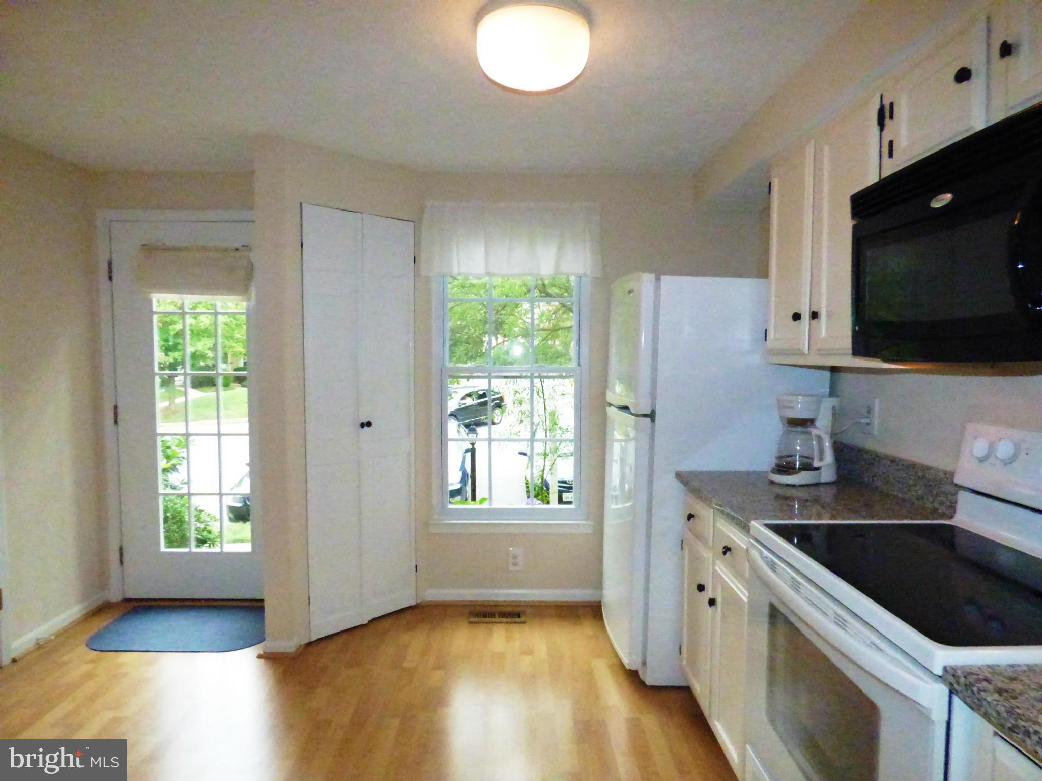 1634 Fieldthorn Drive Reston, VA 20194 - Photo 4 of 30 a kitchen with stainless steel appliances granite countertop a sink stove and refrigerator