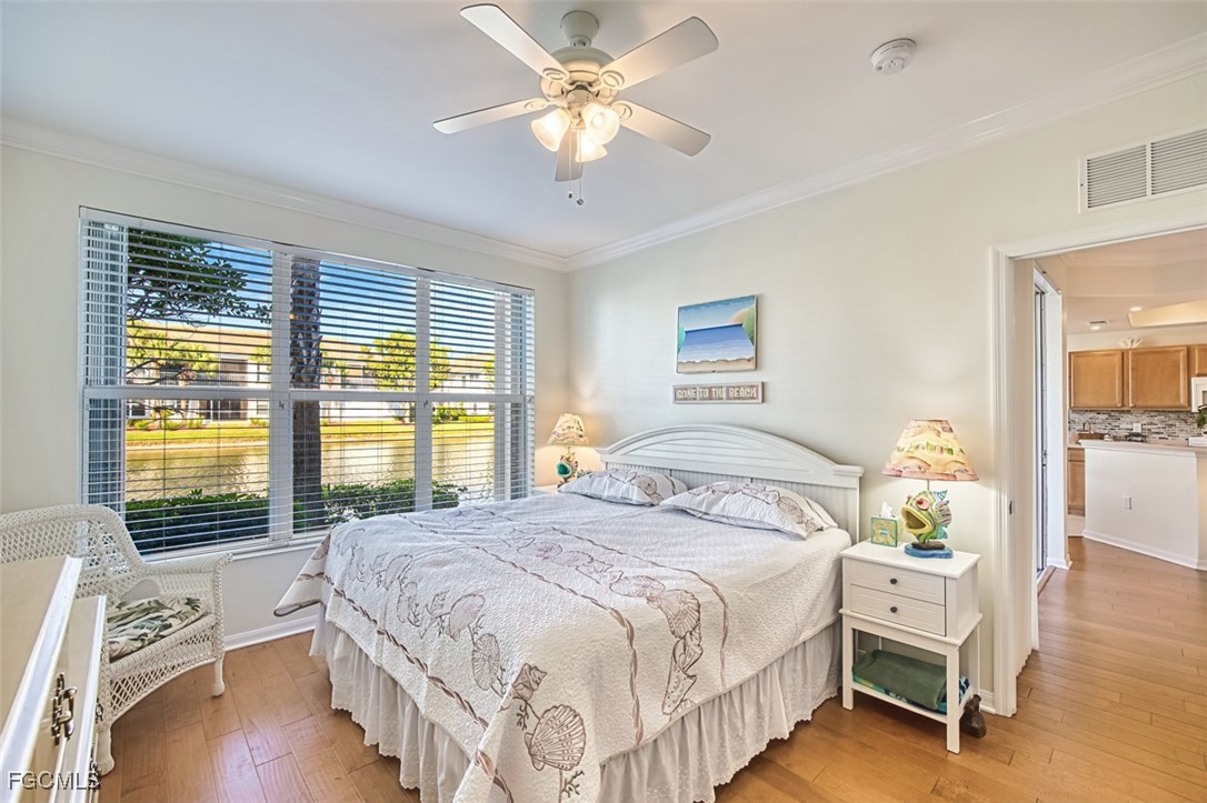 11611 Navarro Way, Unit 2002 Fort Myers, FL 33908 - Photo 17 of 45 a bedroom with a bed and a window