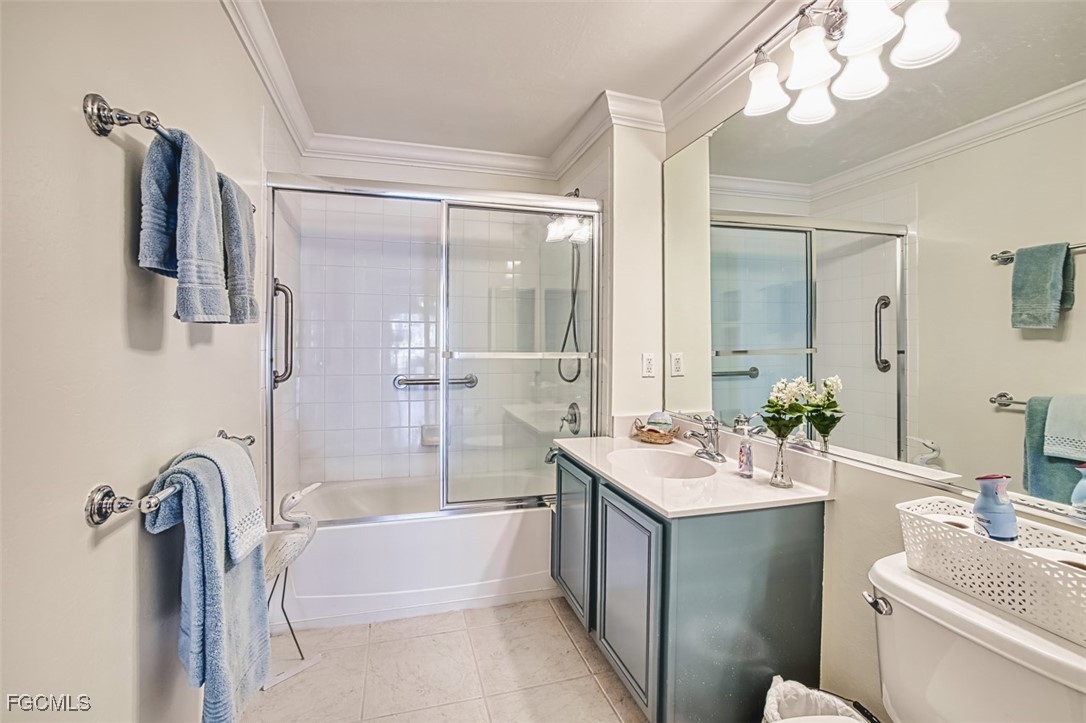 11611 Navarro Way, Unit 2002 Fort Myers, FL 33908 - Photo 29 of 45 a bathroom with a tub sink and mirror