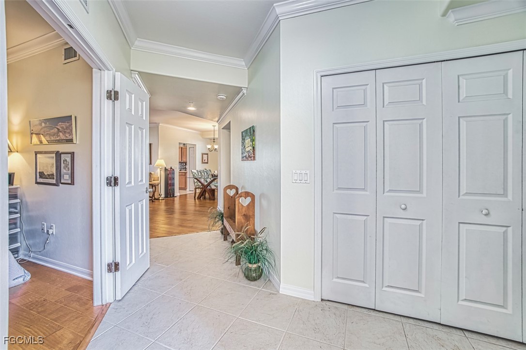 11611 Navarro Way, Unit 2002 Fort Myers, FL 33908 - Photo 31 of 45 a view of a hallway with dining area