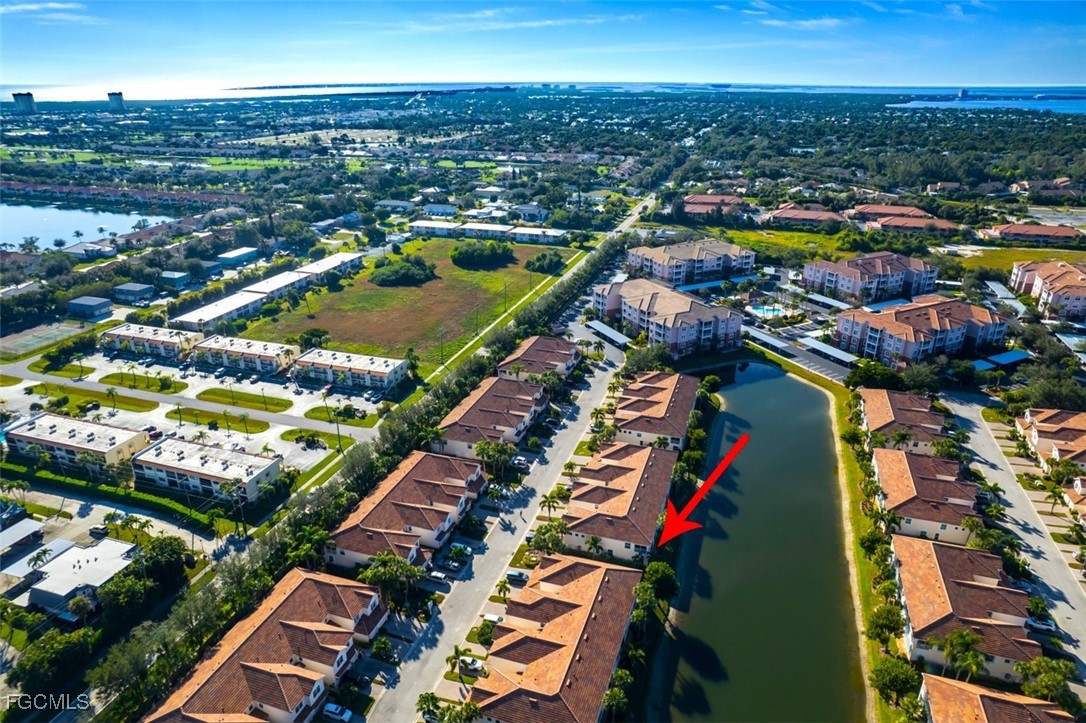 11611 Navarro Way, Unit 2002 Fort Myers, FL 33908 - Photo 41 of 45 an aerial view of residential houses with outdoor space