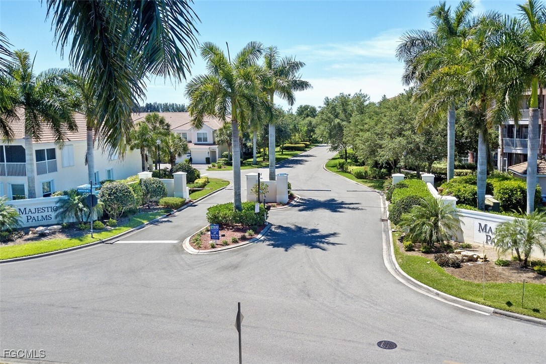 11611 Navarro Way, Unit 2002 Fort Myers, FL 33908 - Photo 43 of 45 a view of a swimming pool with a garden and plants