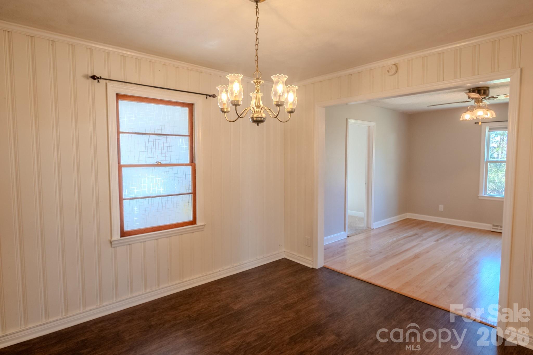 2113 Randolph Road Shelby, NC 28150 - Photo 13 of 39 a view of an empty room with a window and wooden floor