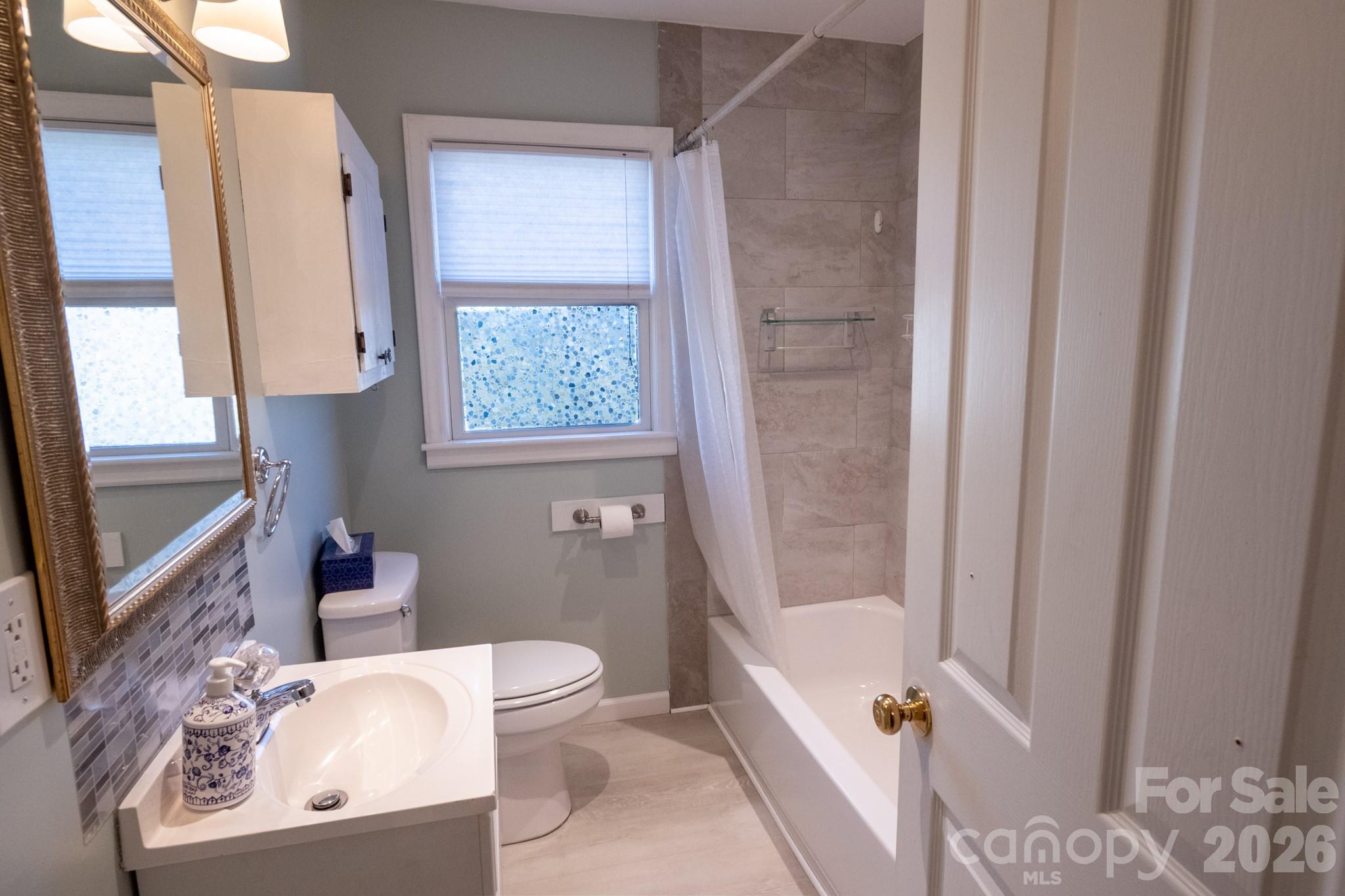 2113 Randolph Road Shelby, NC 28150 - Photo 21 of 39 a bathroom with a sink toilet and shower