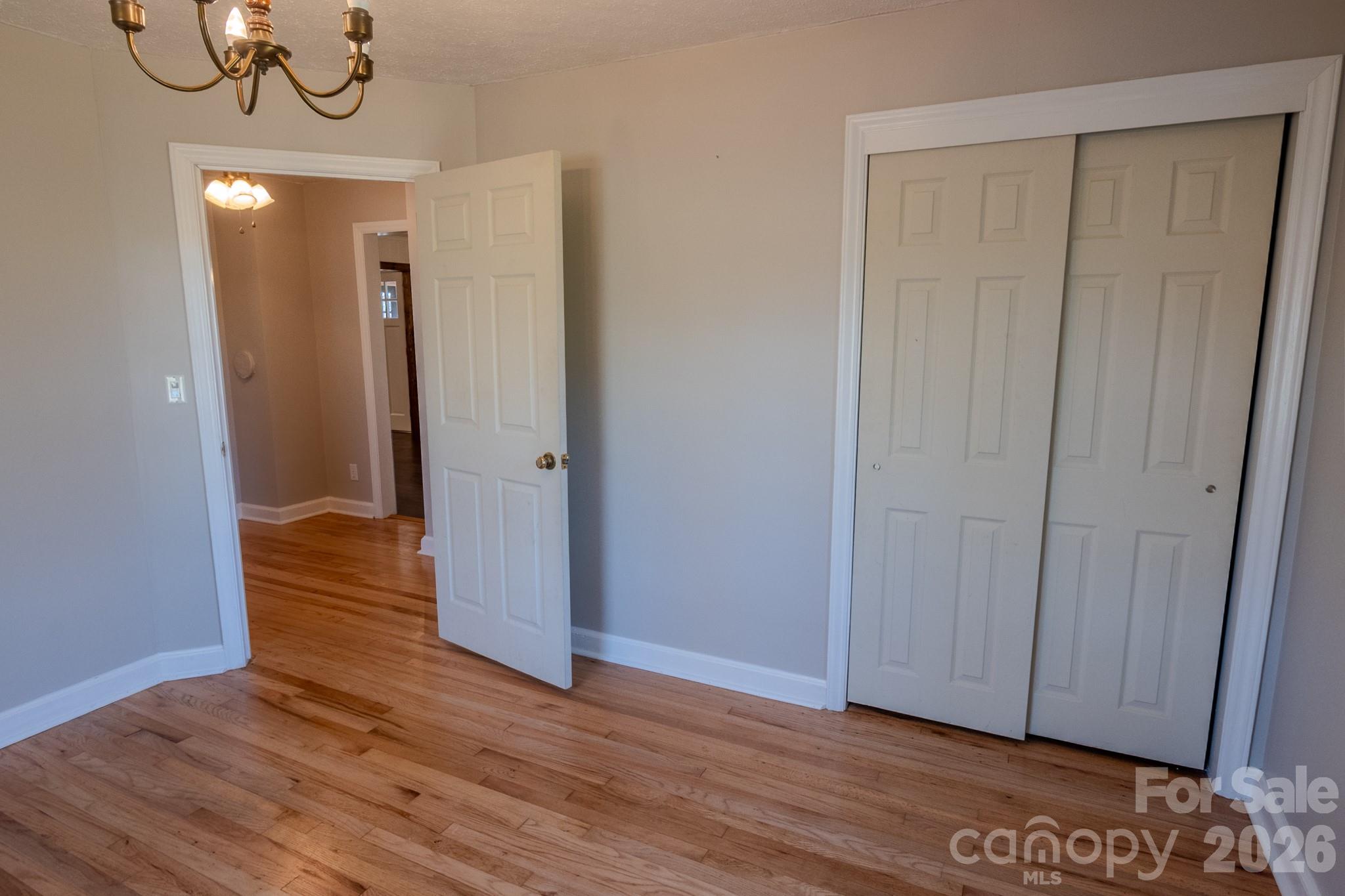 2113 Randolph Road Shelby, NC 28150 - Photo 26 of 39 a view of empty room with wooden floor