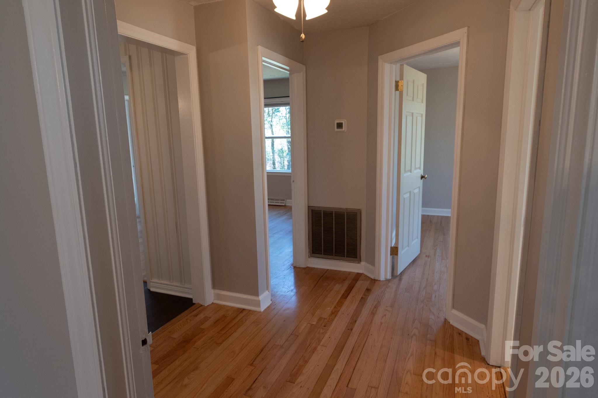 2113 Randolph Road Shelby, NC 28150 - Photo 27 of 39 a view of a hallway with wooden floor
