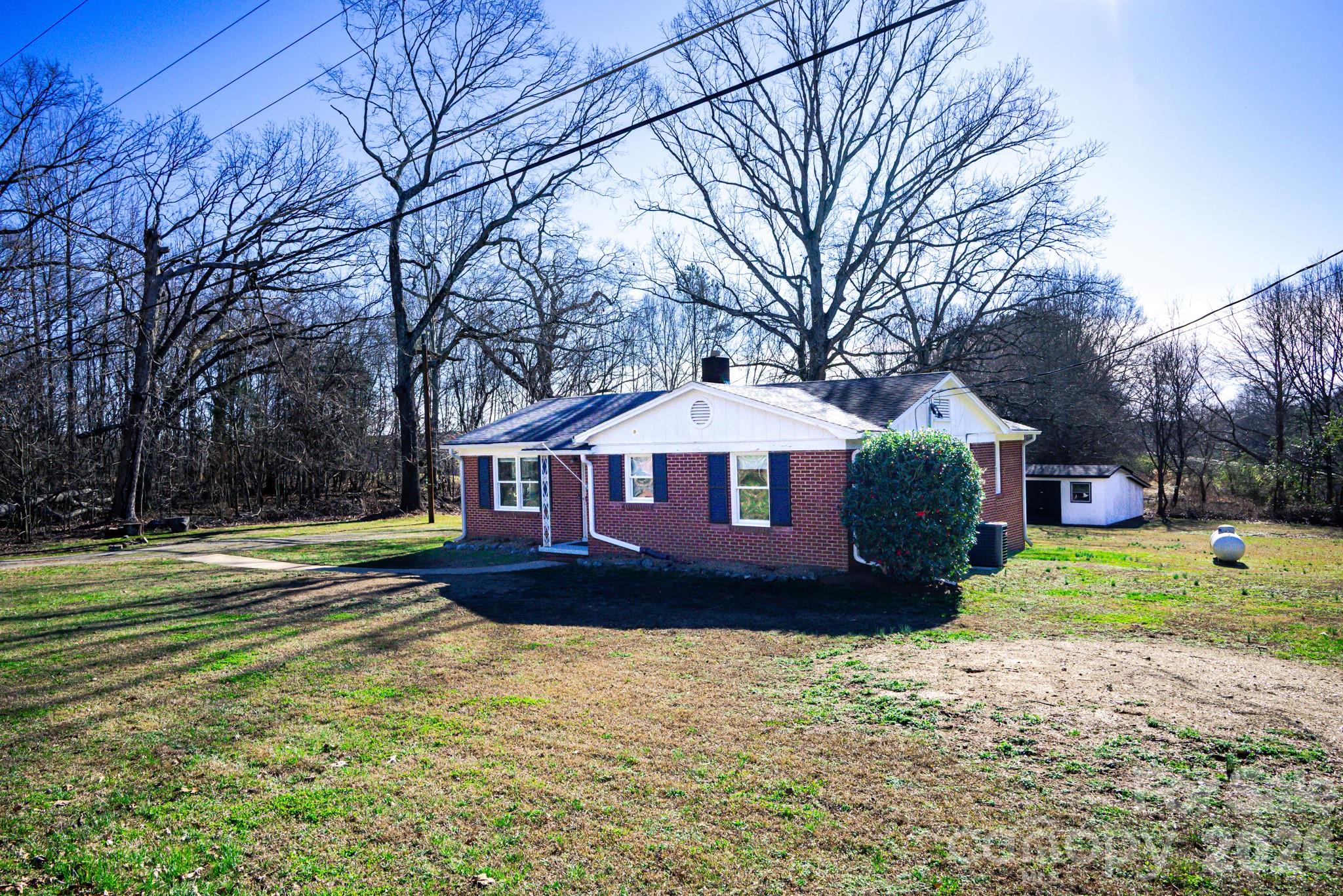 2113 Randolph Road Shelby, NC 28150 - Photo 37 of 39 a front view of a house with a yard