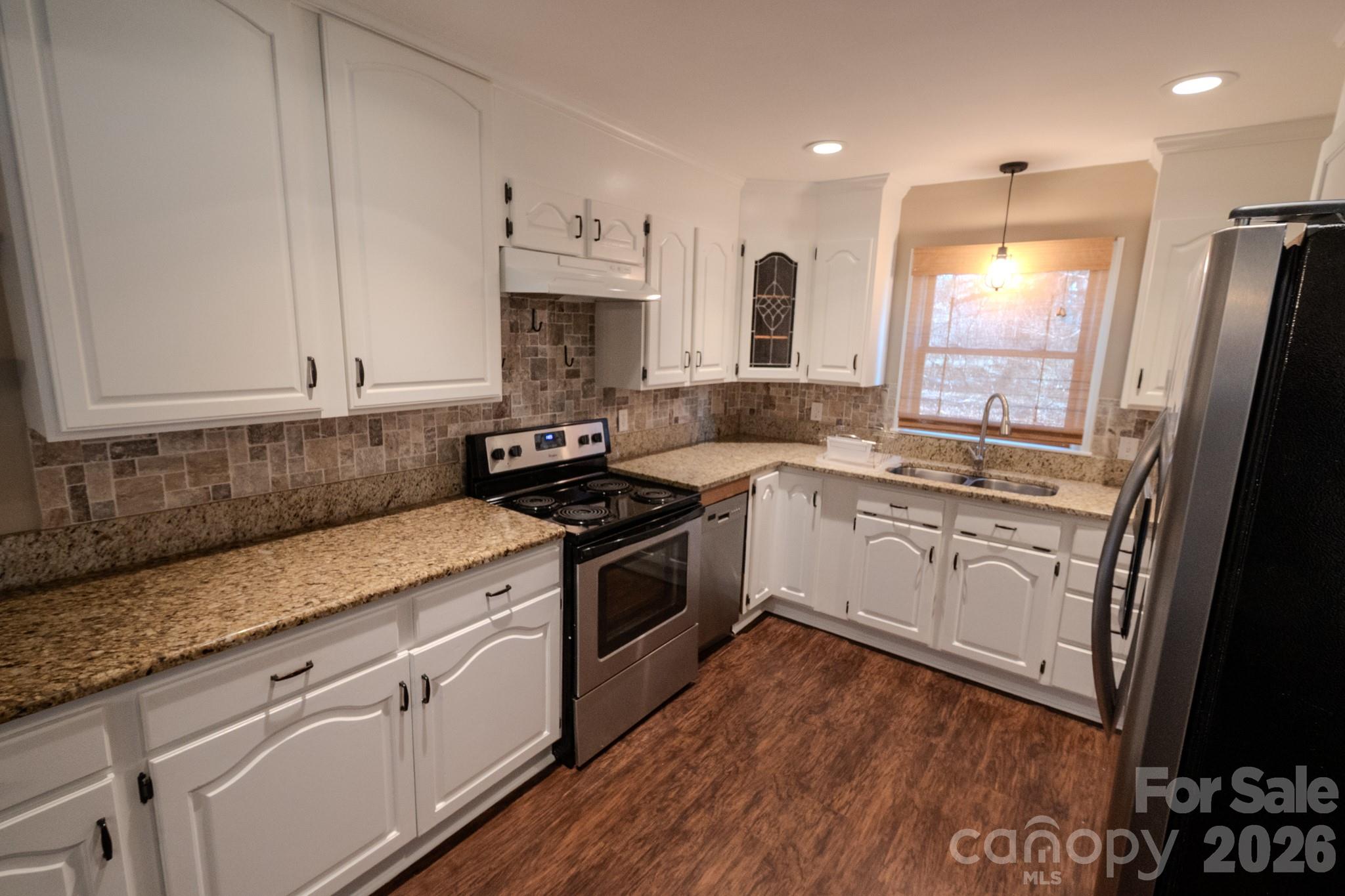 2113 Randolph Road Shelby, NC 28150 - Photo 6 of 39 a white kitchen with granite countertop stainless steel appliances