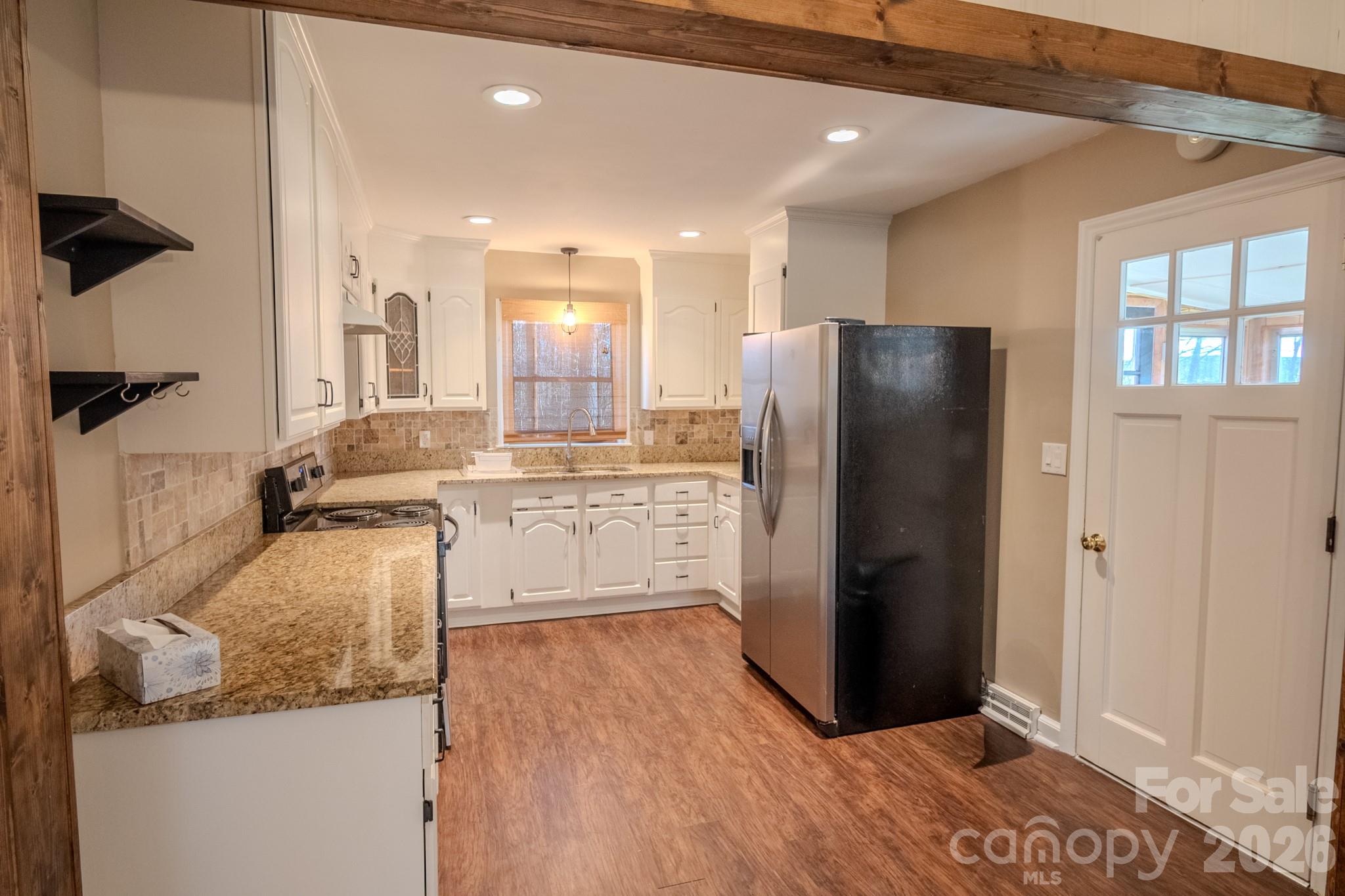 2113 Randolph Road Shelby, NC 28150 - Photo 10 of 39 a kitchen with stainless steel appliances granite countertop a refrigerator and a sink