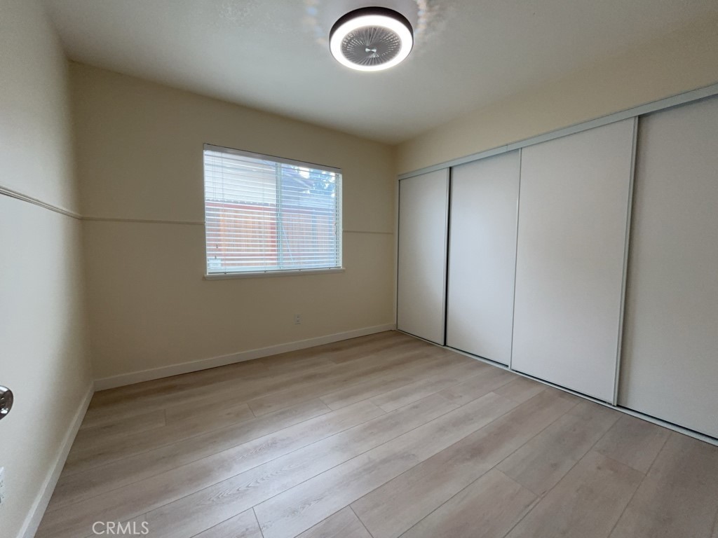 9263 Owari Lane Riverside, CA 92508 - Photo 13 of 17 an empty room with windows and closet