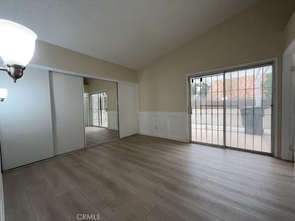 9263 Owari Lane Riverside, CA 92508 - Photo 15 of 17 an empty room with wooden floor and windows